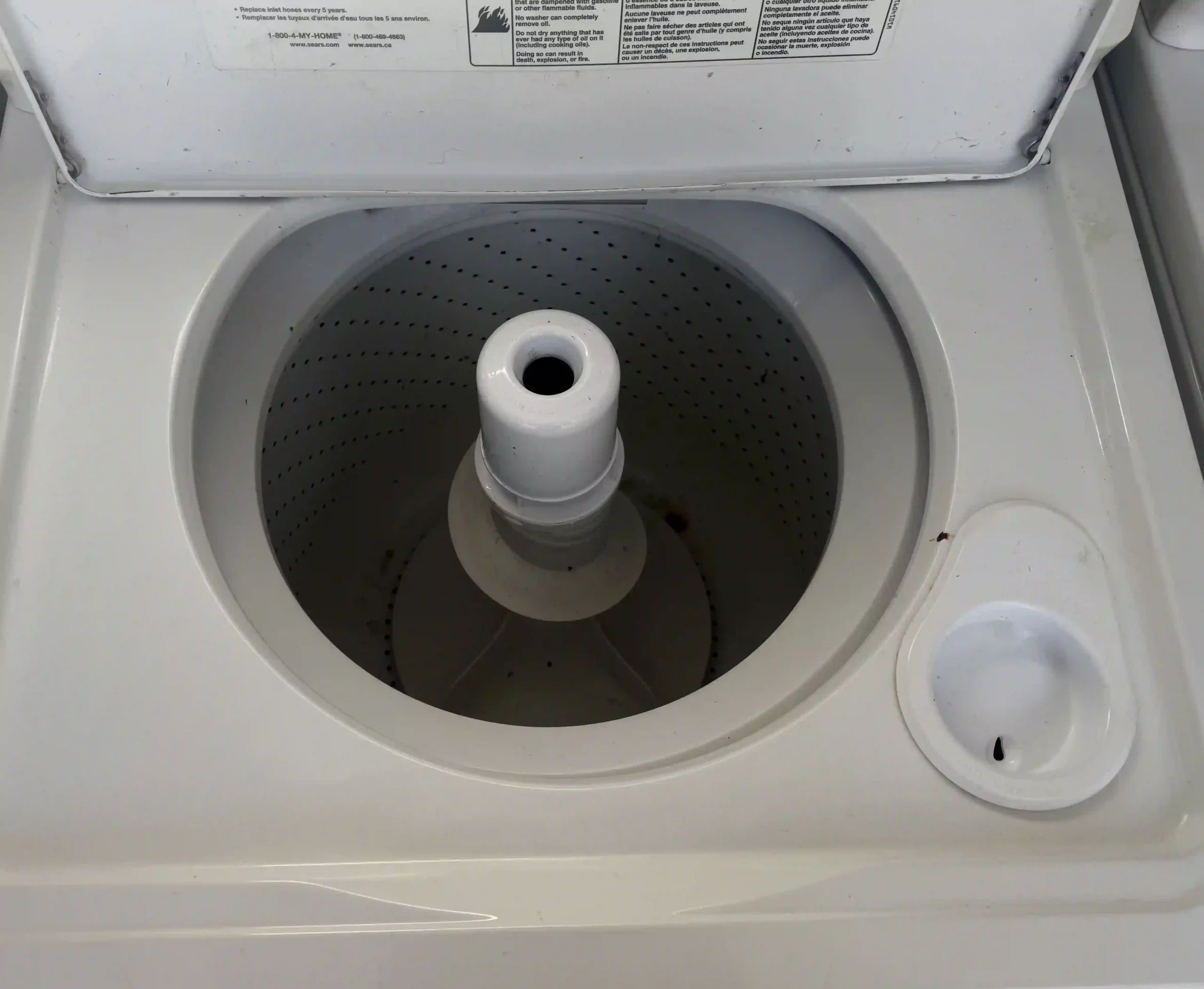 Kenmore top-load washer tub interior with center agitator