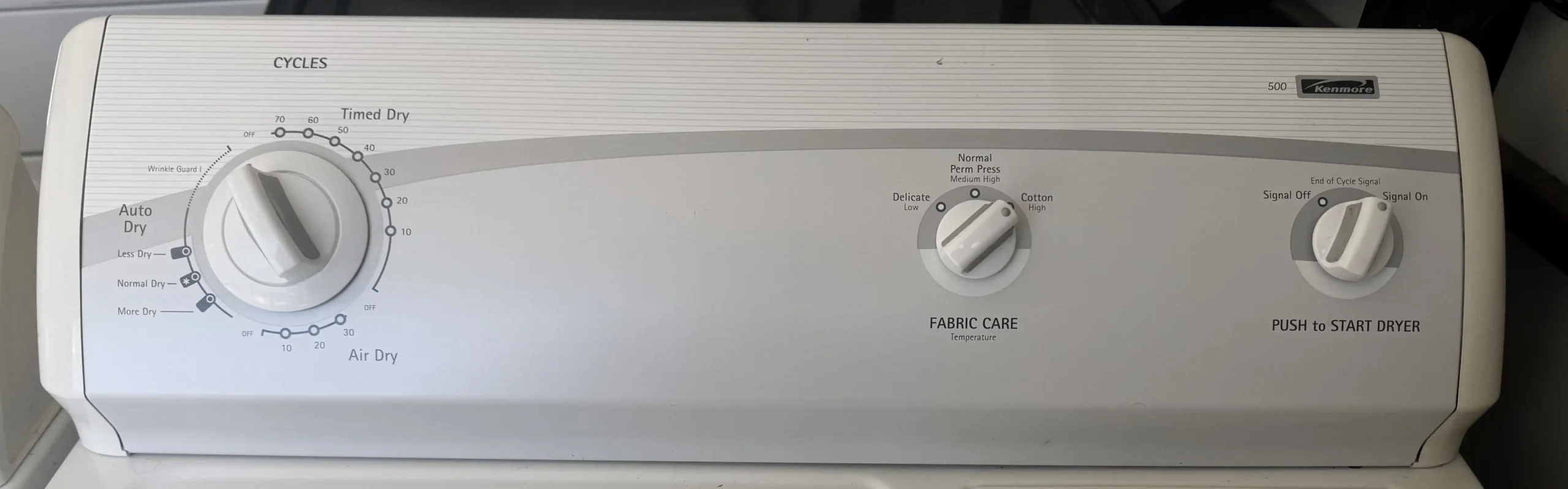 Kenmore electric dryer control panel with cycle and fabric care selectors