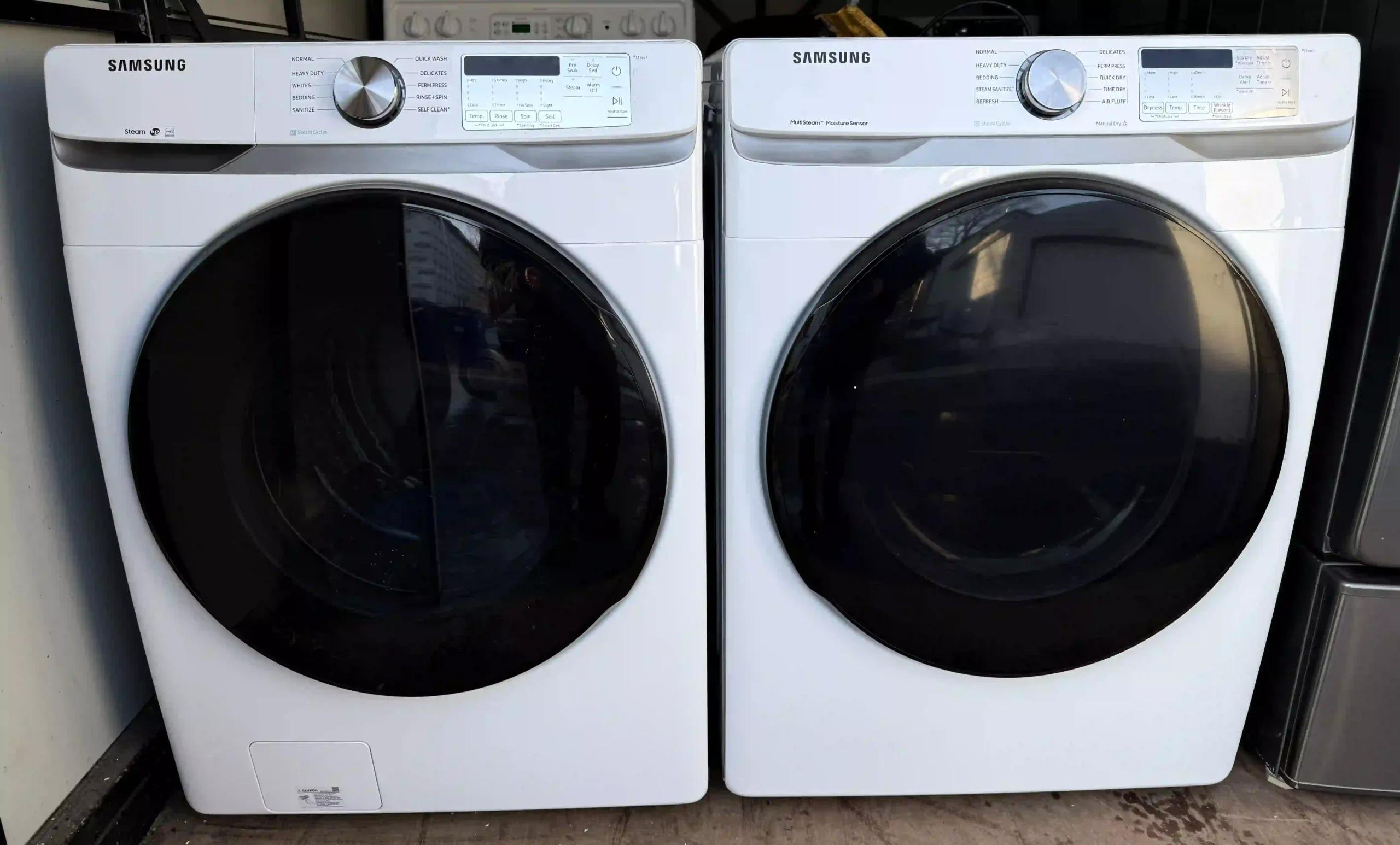 Samsung 4.5 cubic foot front-load washer and matching gas dryer set, front view