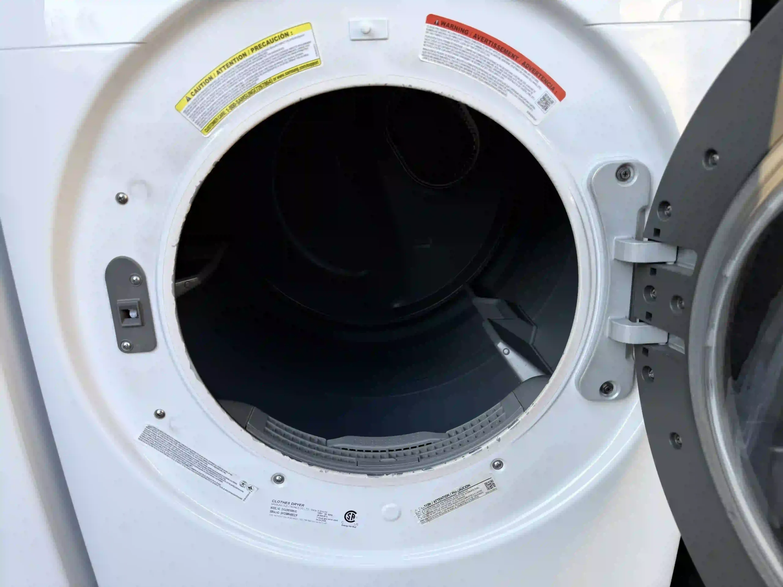 Samsung washer with door open showing stainless drum