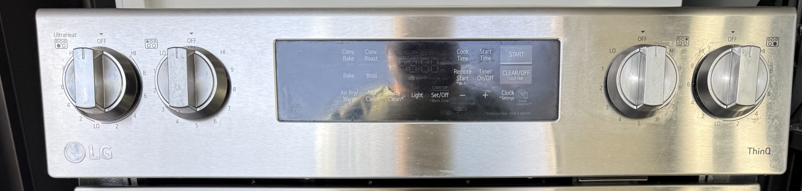 LG stainless steel electric range oven interior with door open