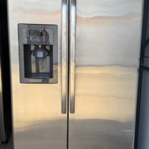 GE stainless steel refrigerator side-by-side style, front view with doors closed
