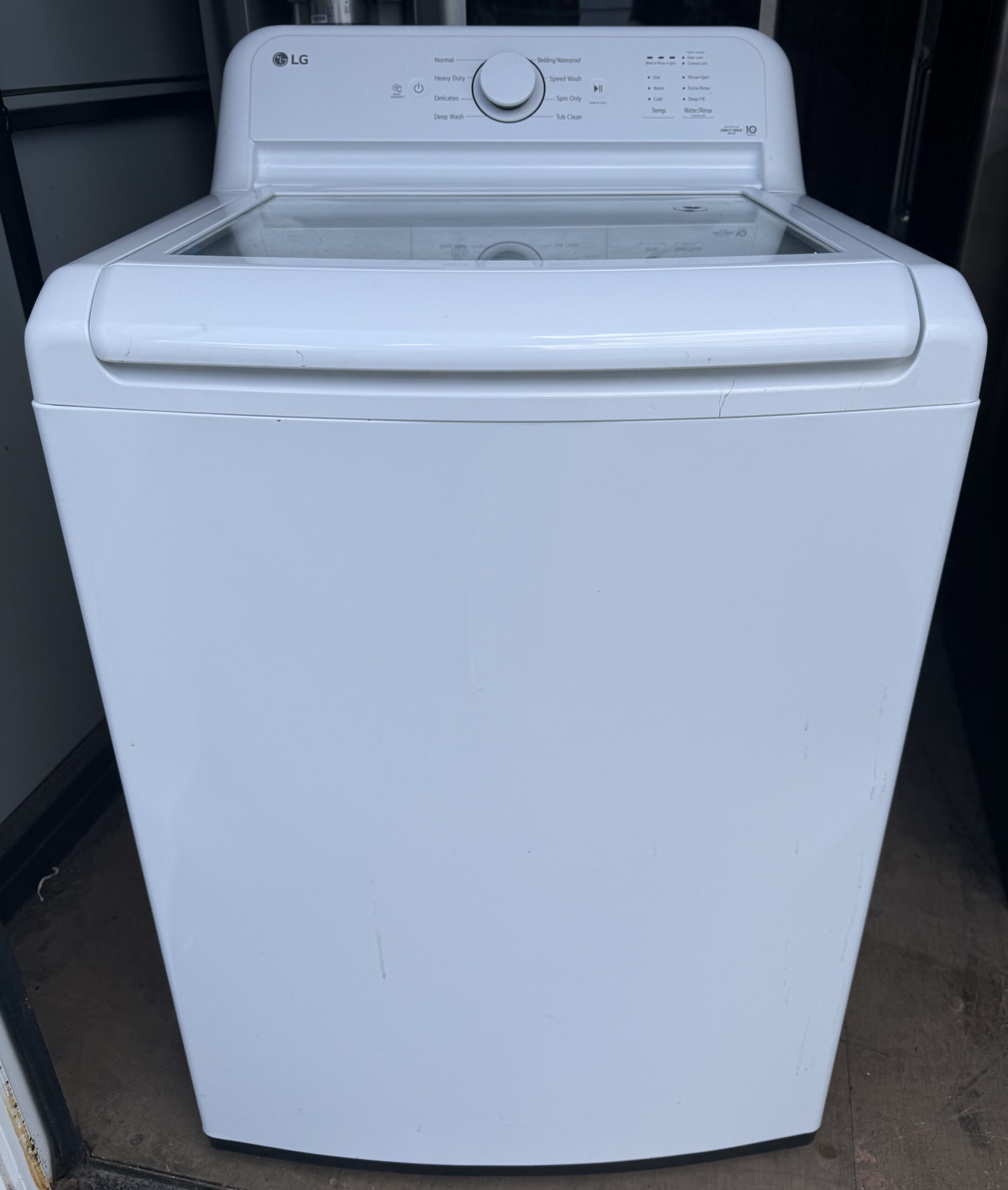 LG washer top-load style, front view with lid closed