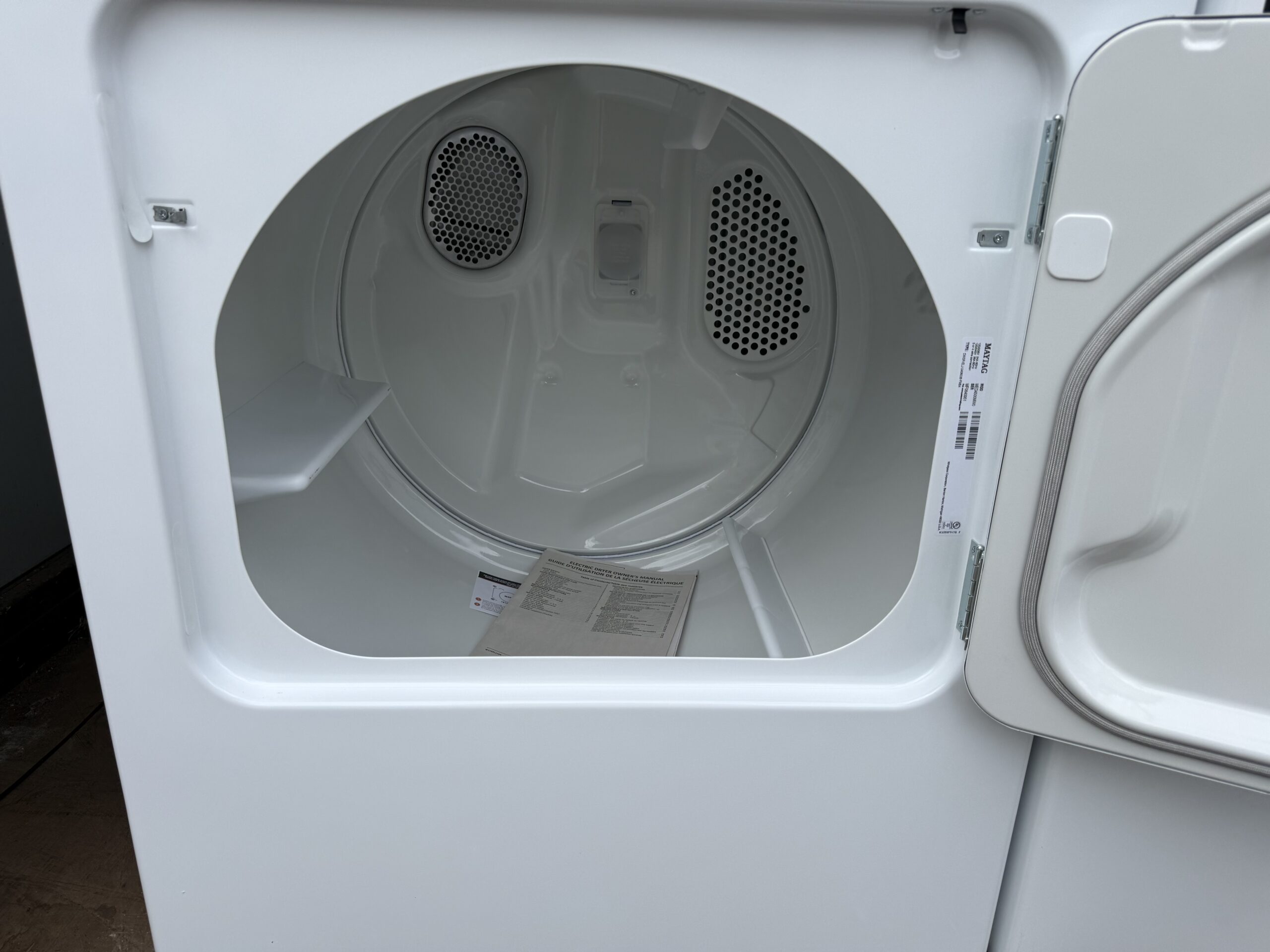 Maytag electric dryer drum interior viewed through open door