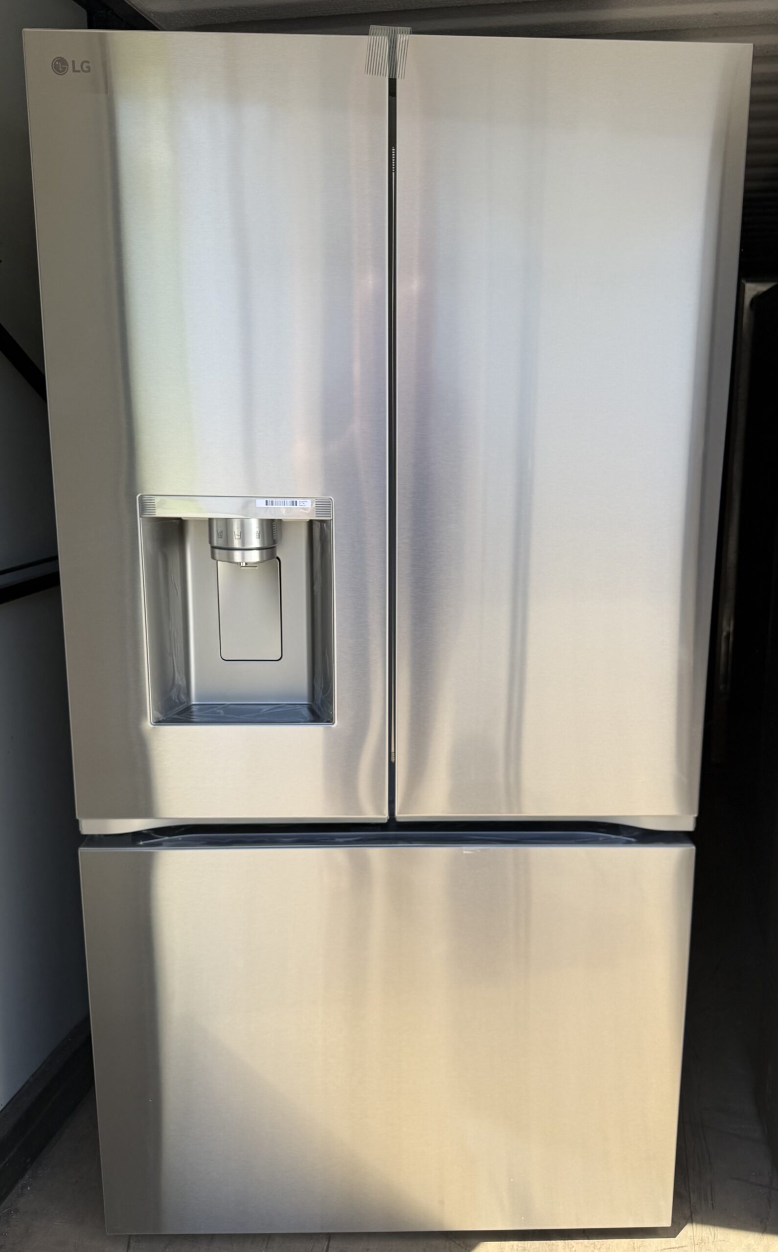 LG French door refrigerator 26 cu ft stainless steel, front view with exterior water dispenser