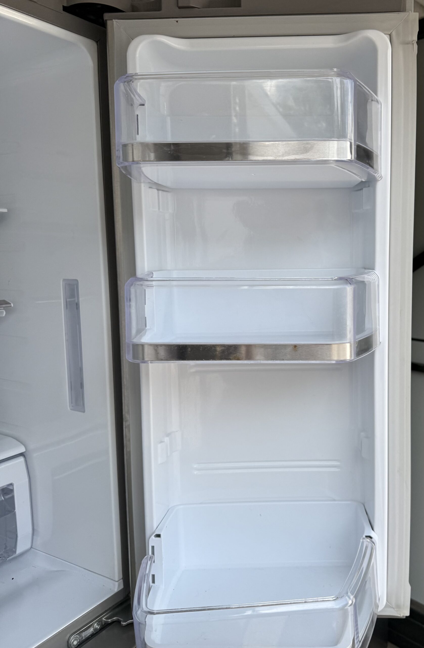Samsung refrigerator right door interior with adjustable shelf bins for gallon-size storage