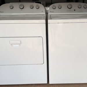 Whirlpool top-load washer and electric dryer set in white, shown side by side