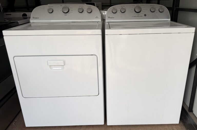 Whirlpool top-load washer and electric dryer set in white, shown side by side