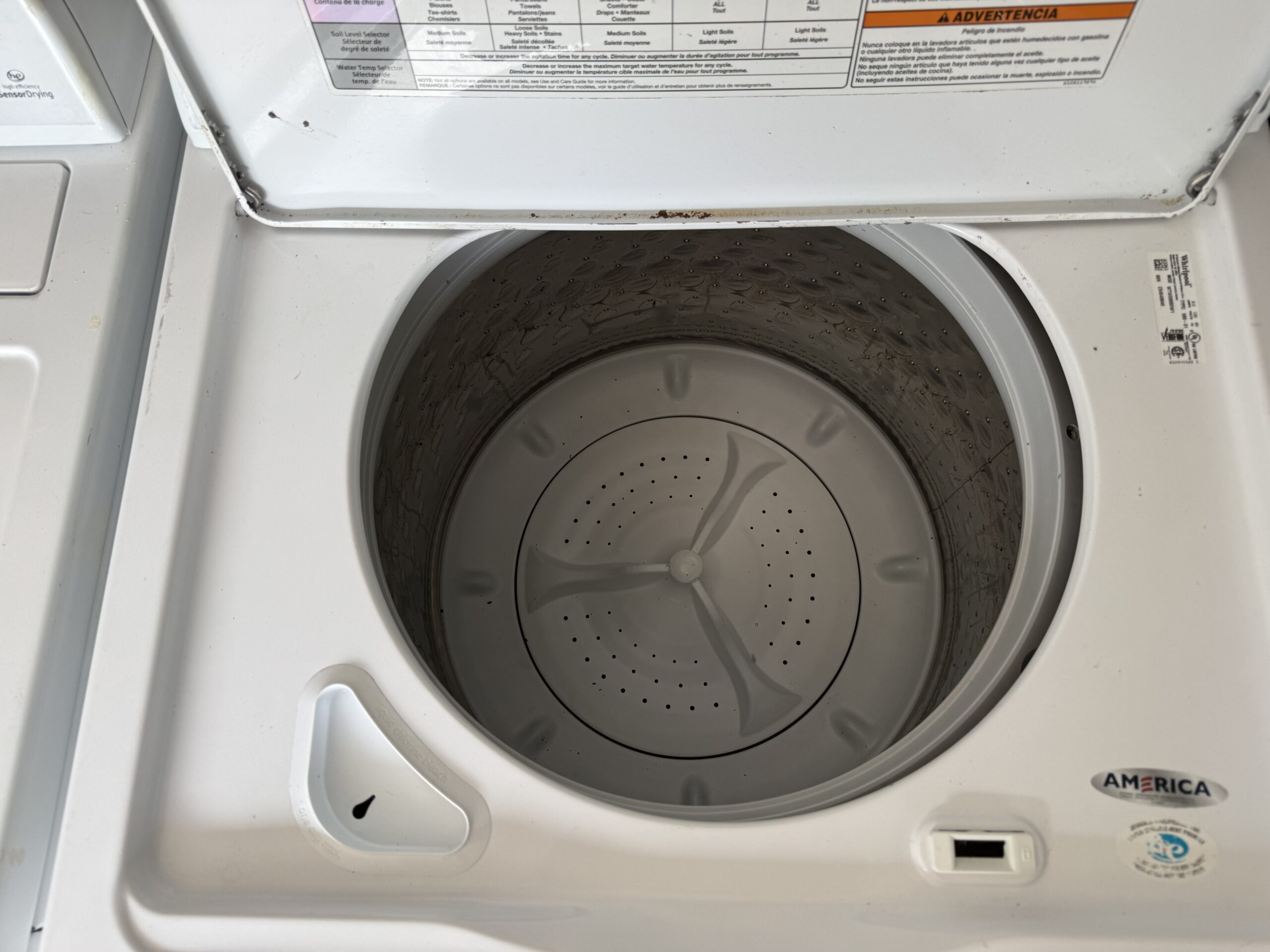 Whirlpool top load washer drum interior viewed from top with lid open