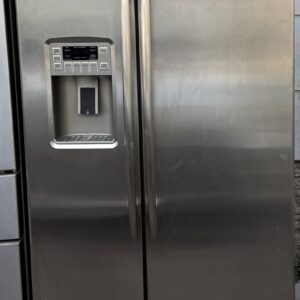 GE Profile side-by-side refrigerator stainless steel — front view with ice and water dispenser.