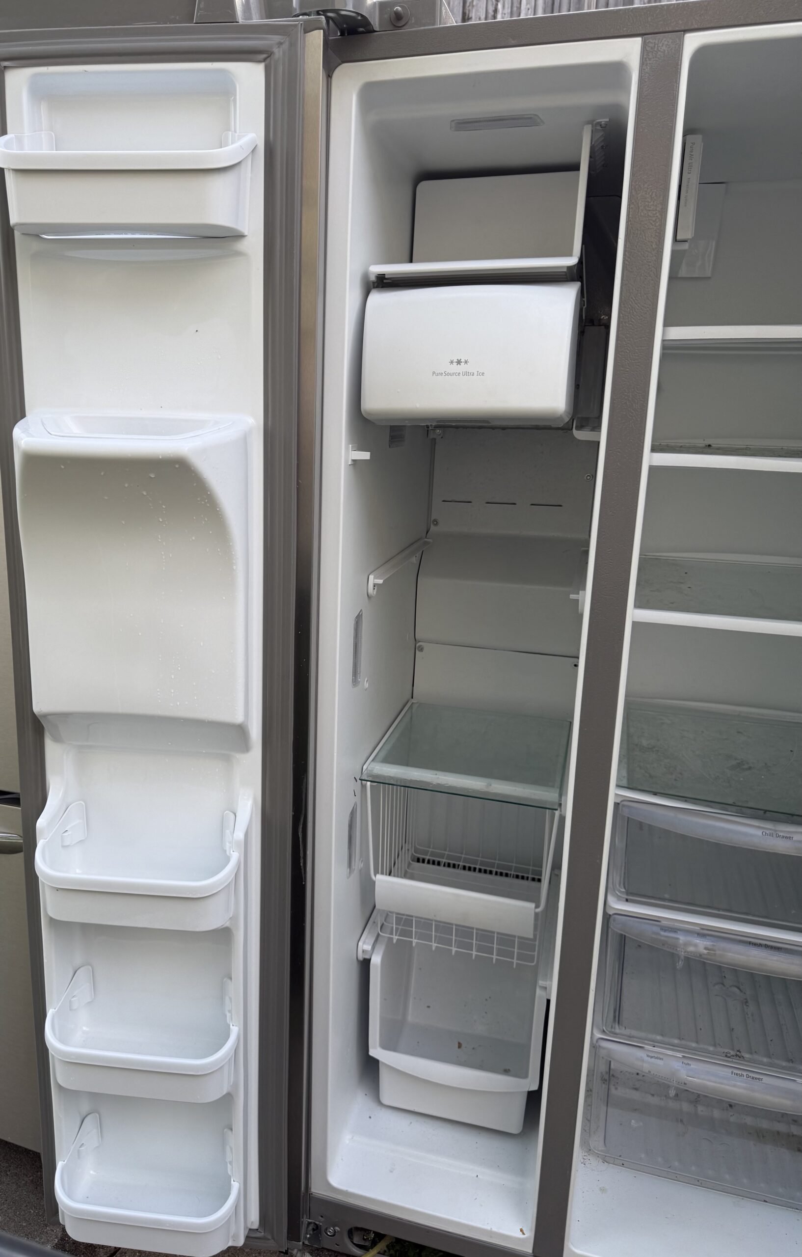 Frigidaire Gallery side-by-side refrigerator freezer door bins with ice maker