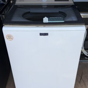 Maytag white top-load washer front view with stainless control panel