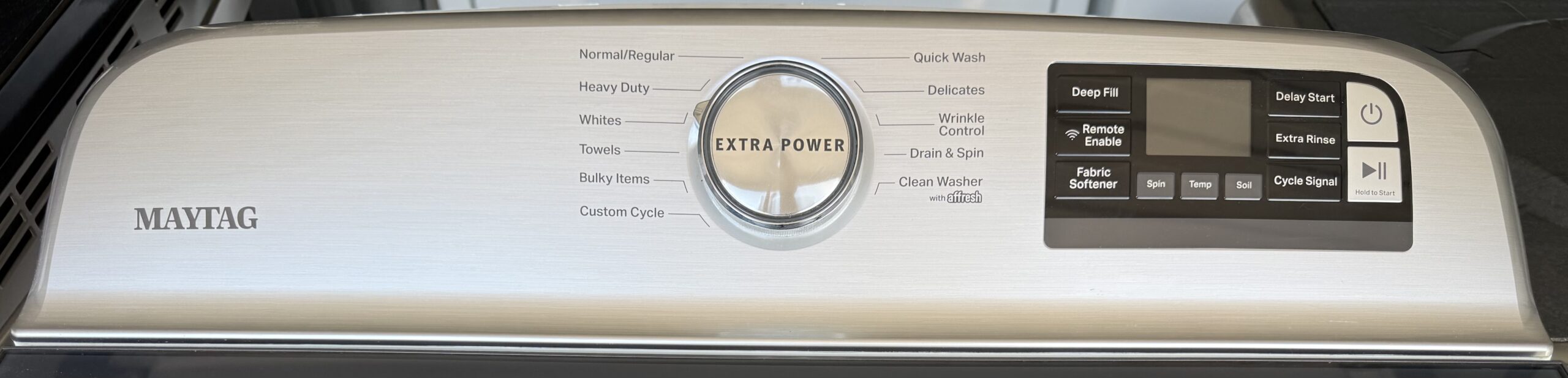 Maytag washer control panel close-up with Extra Power dial and cycle selection buttons
