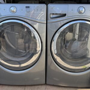 Whirlpool Duet front-load washer and gas dryer set in gray, front view