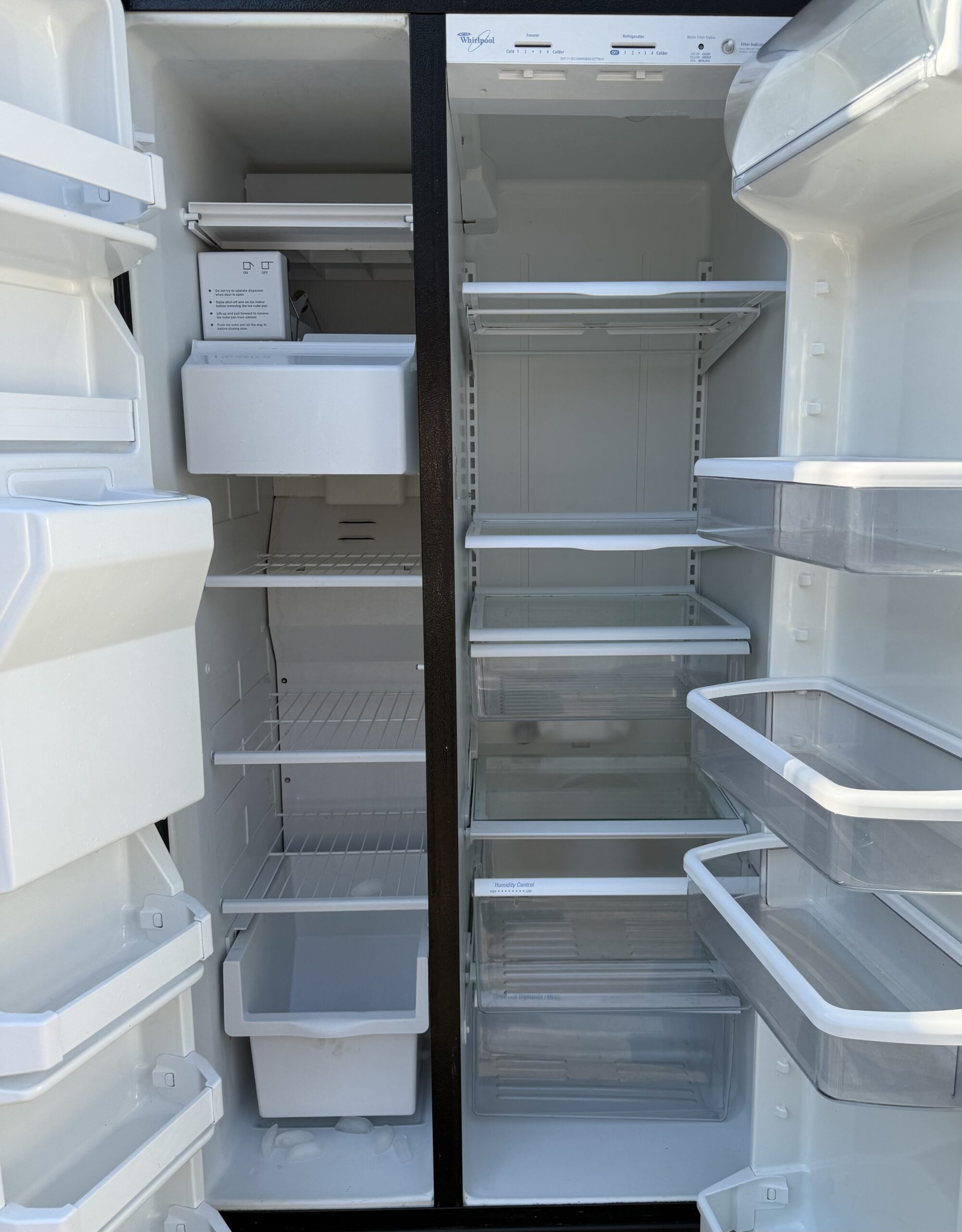Whirlpool side-by-side refrigerator interior, both doors open