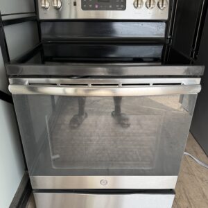 GE 30 inch electric range stainless steel smooth glass top — front view