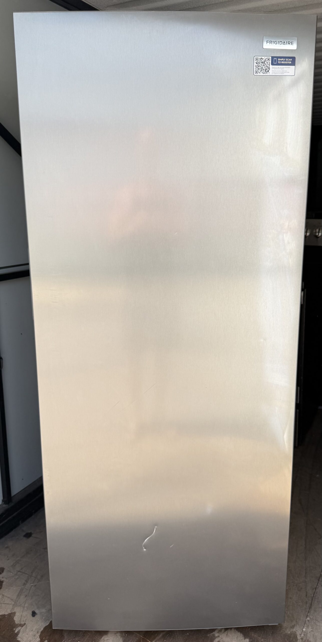 Frigidaire upright freezer stainless steel look single door — front view
