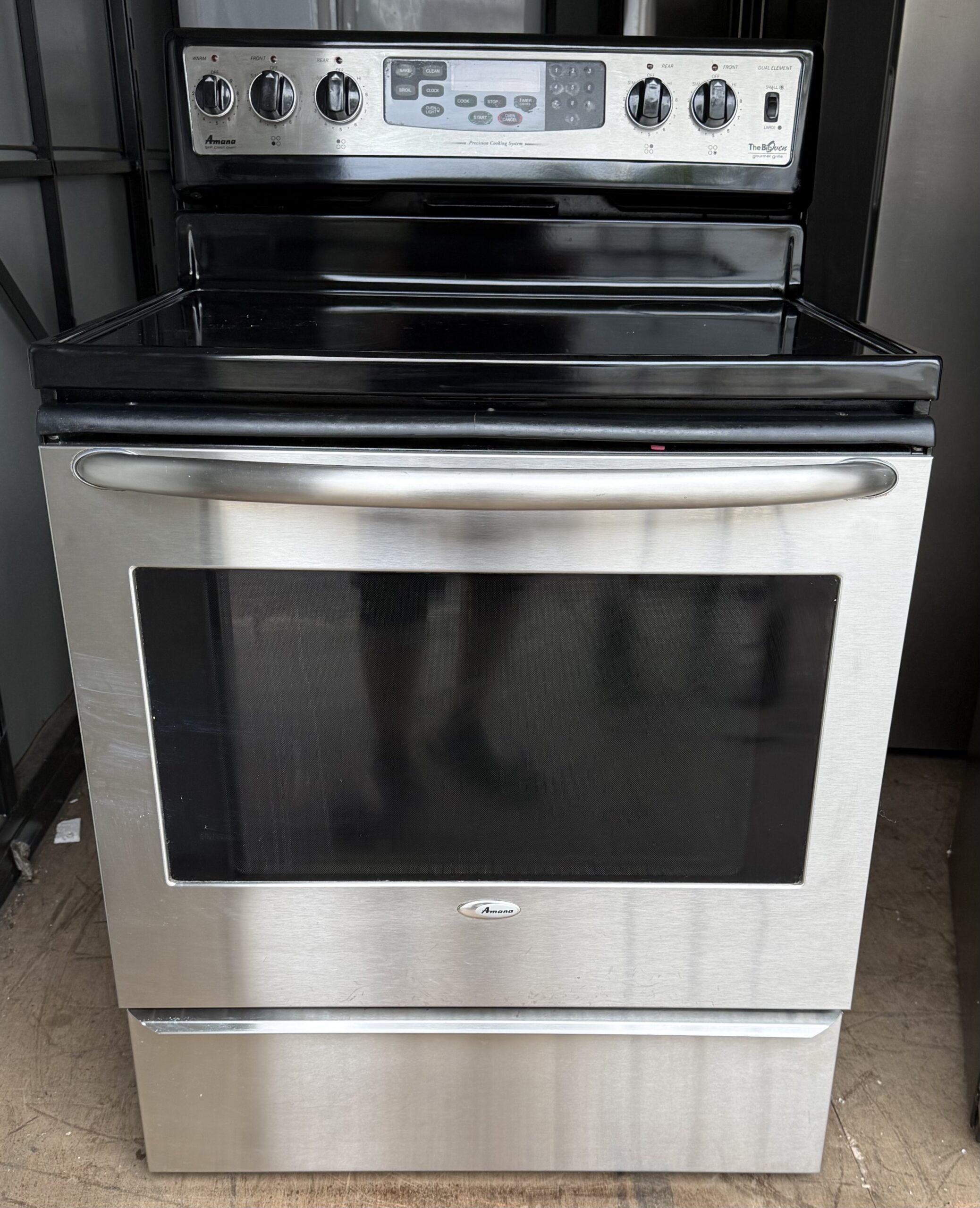 Amana 30 inch electric range stainless steel smooth glass top — front view