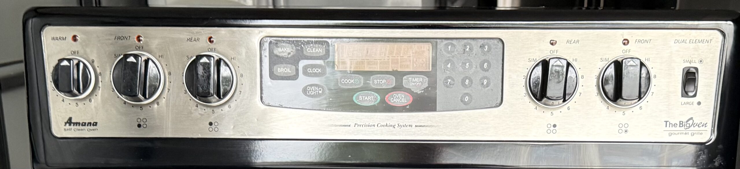 Amana electric range stainless control panel with knobs and digital display