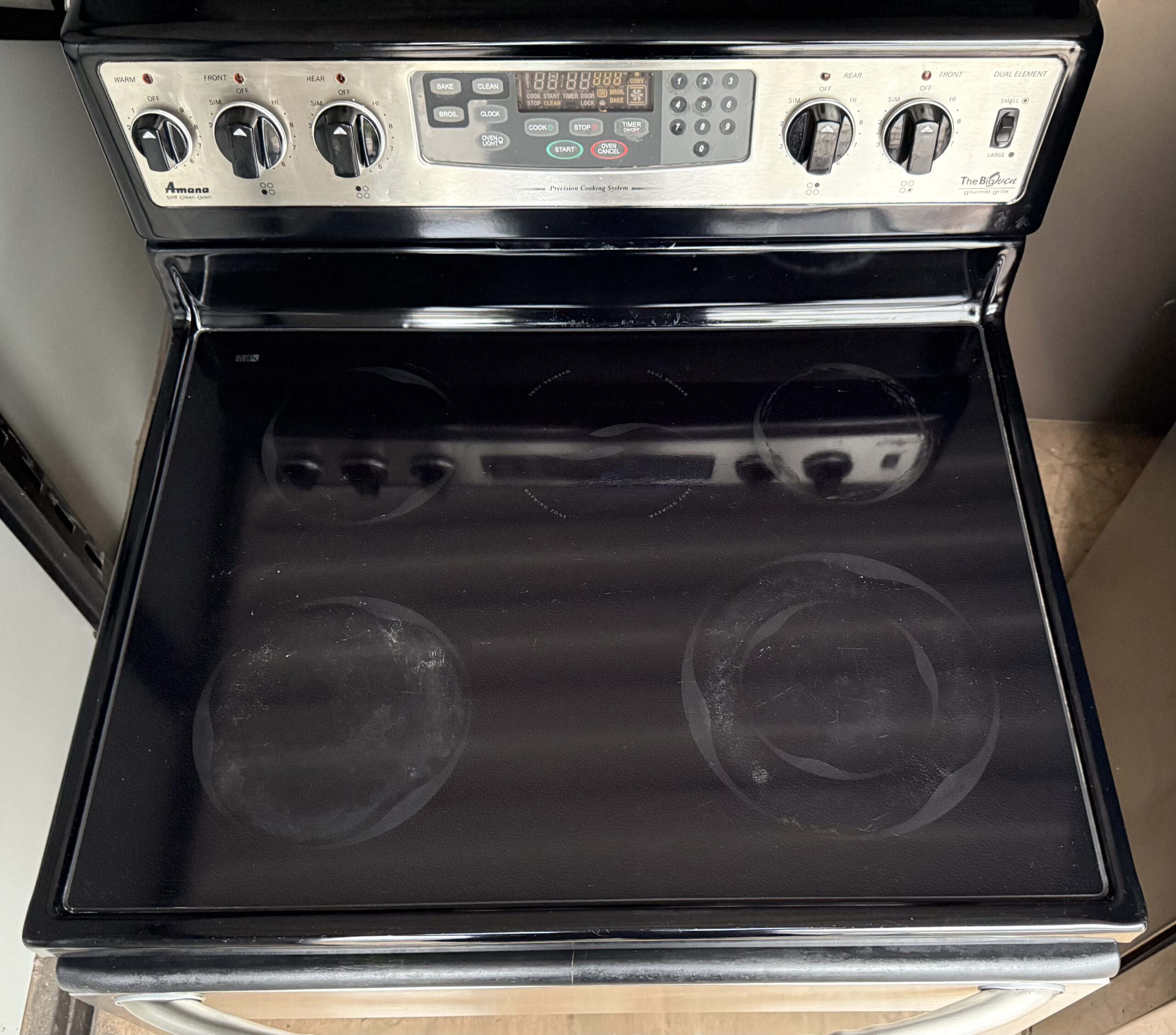 Amana electric range smooth glass-ceramic cooktop with four elements