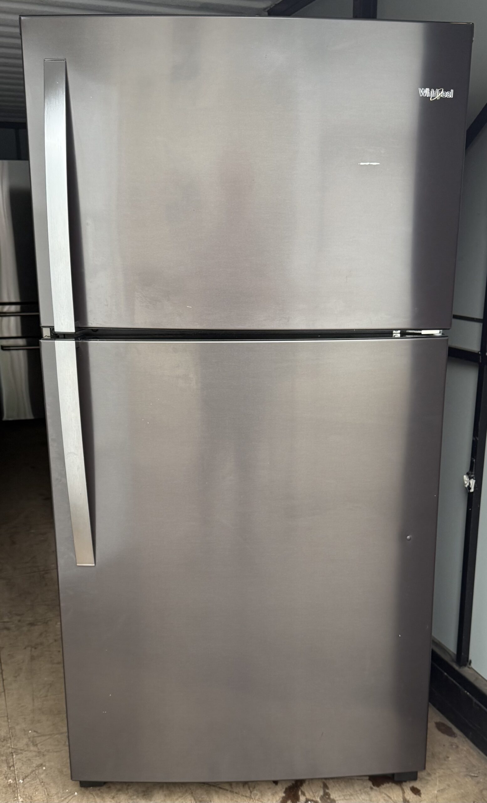 Whirlpool 21 cu ft top freezer refrigerator black stainless — front view