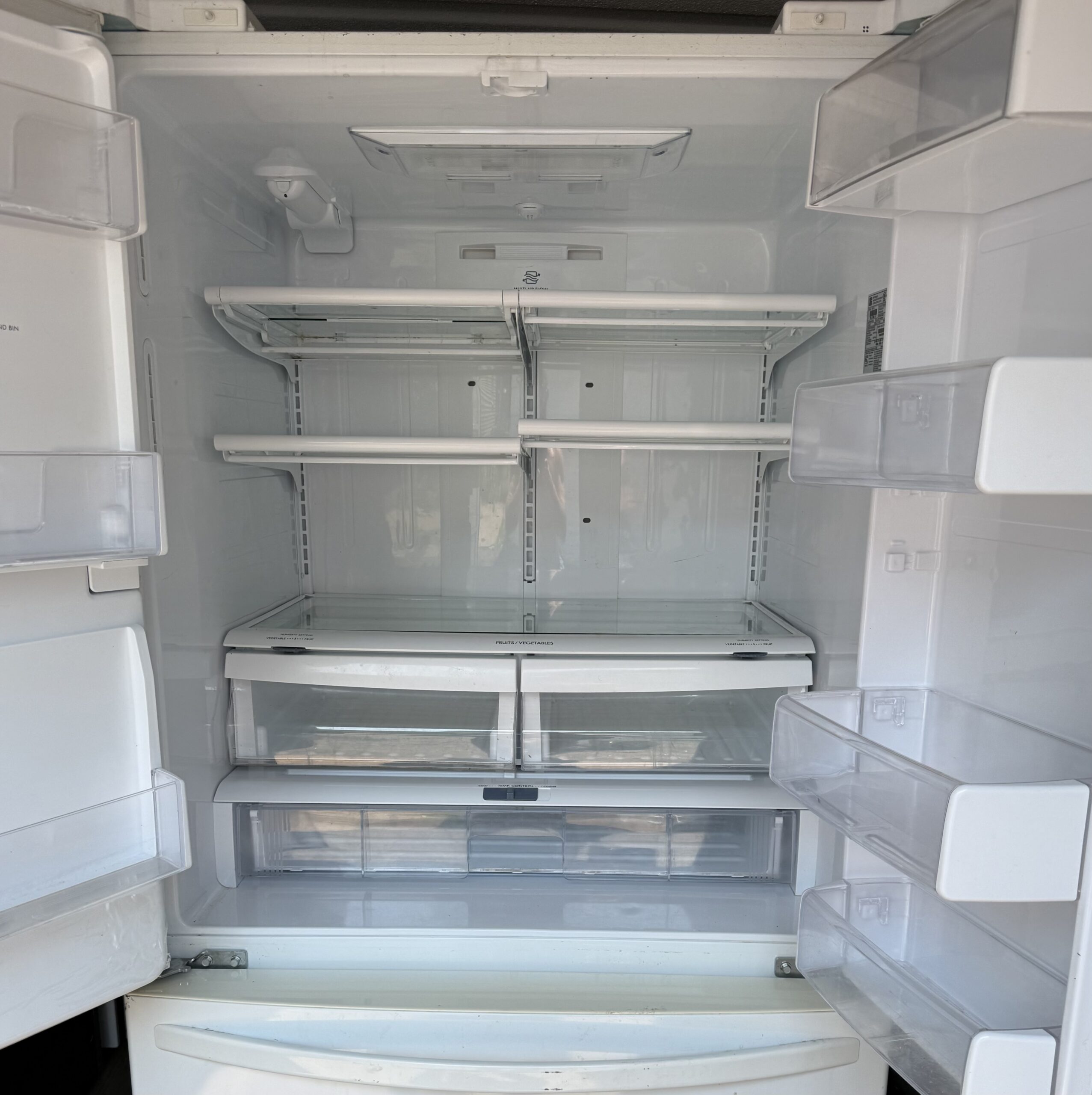 Kenmore refrigerator fresh-food interior with adjustable glass shelves
