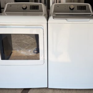 GE top-load washer and electric dryer set white — front view