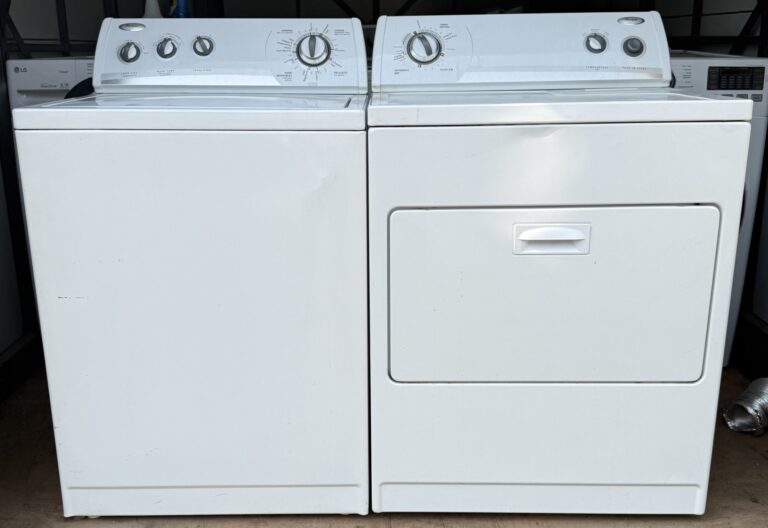 Whirlpool white top-load washer and electric dryer set, front view