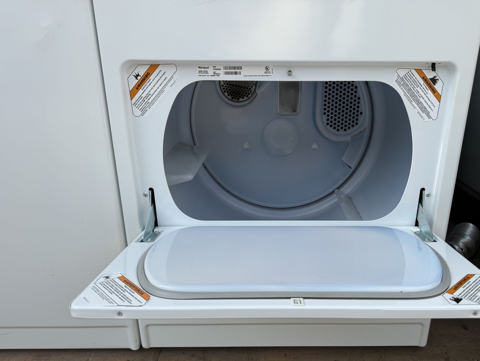 Whirlpool electric dryer drum interior with door open
