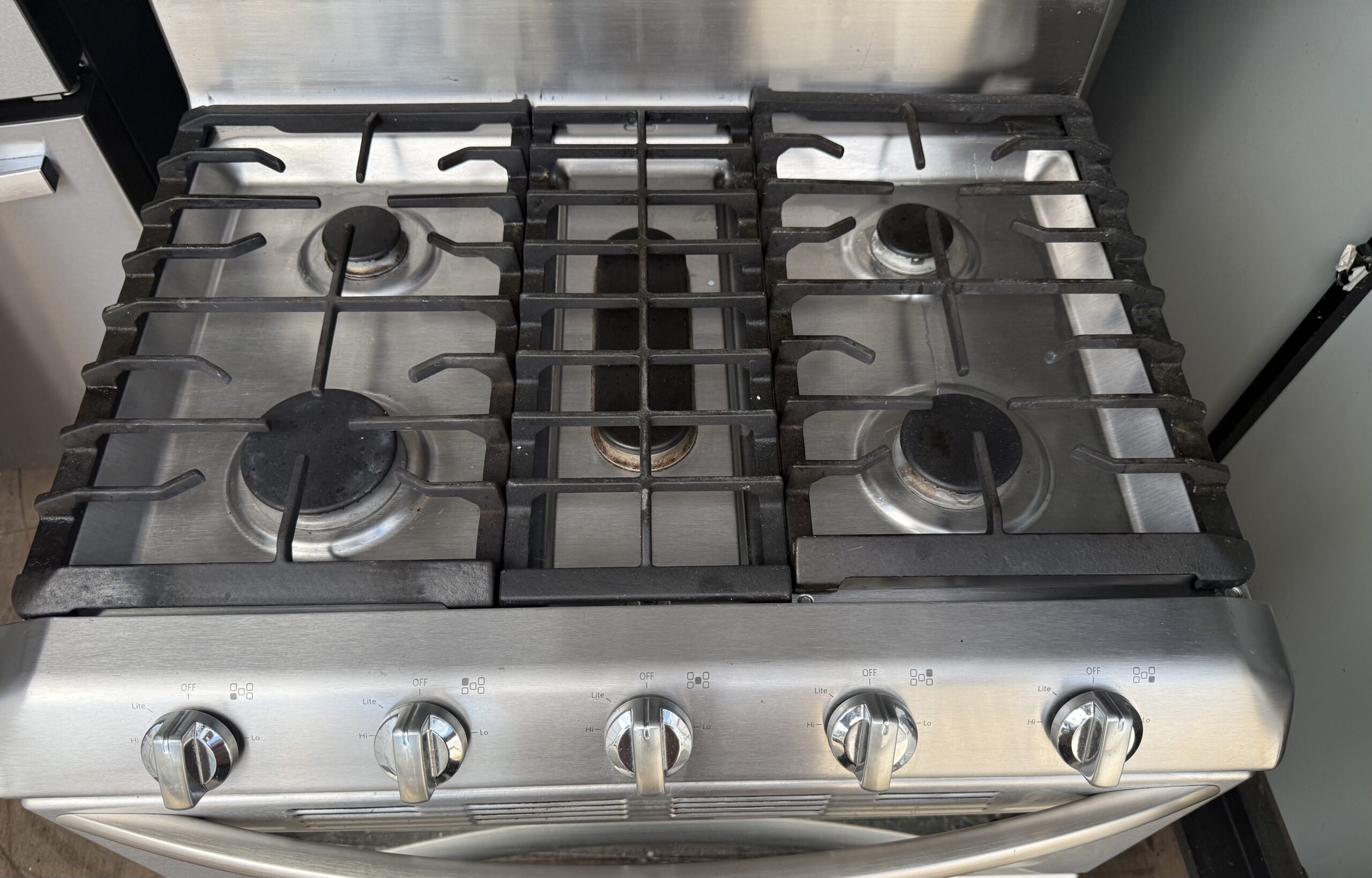 KitchenAid gas range cooktop with five burners and center griddle
