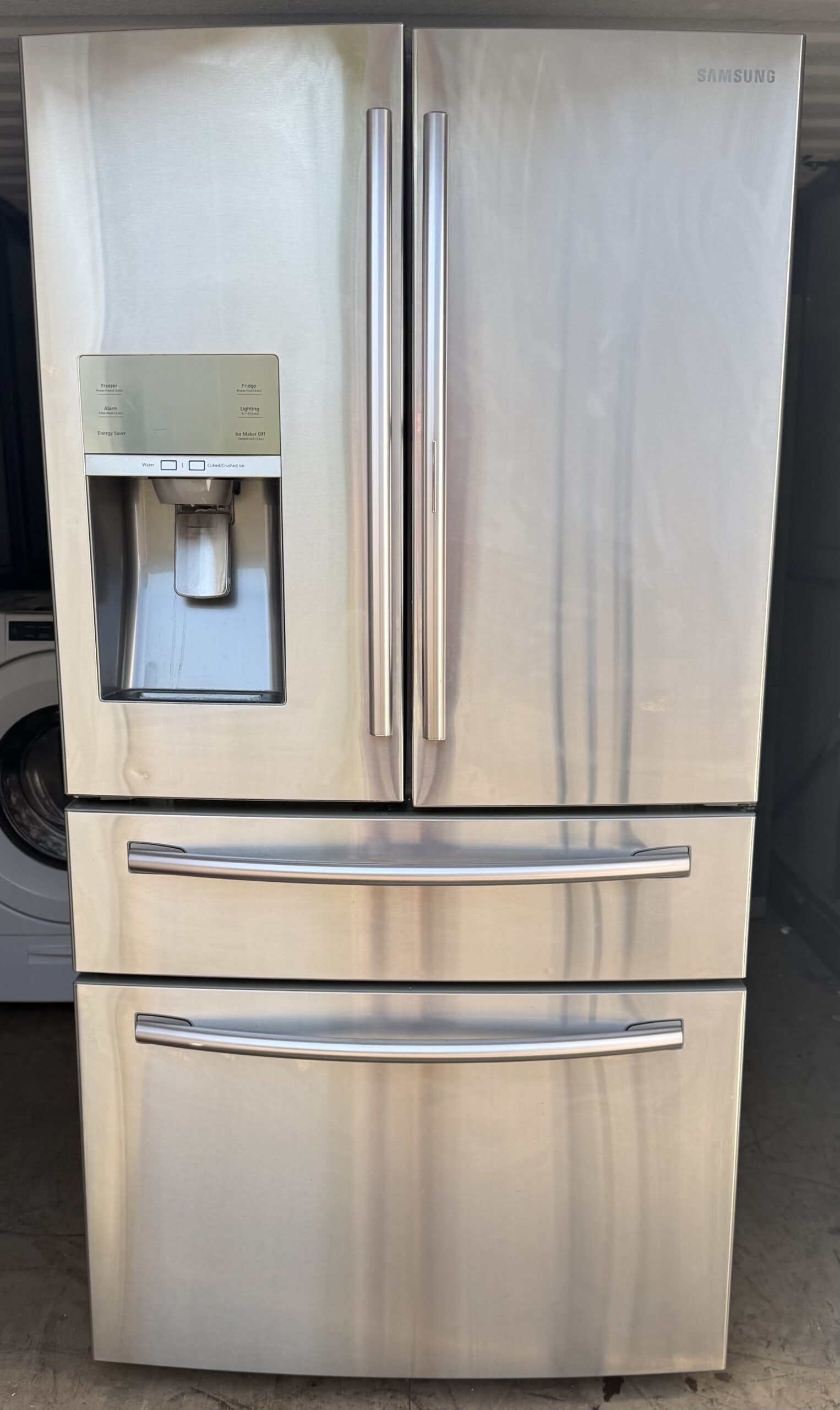 Samsung 28 cu ft 4-door French door refrigerator stainless steel with ice and water dispenser — front view