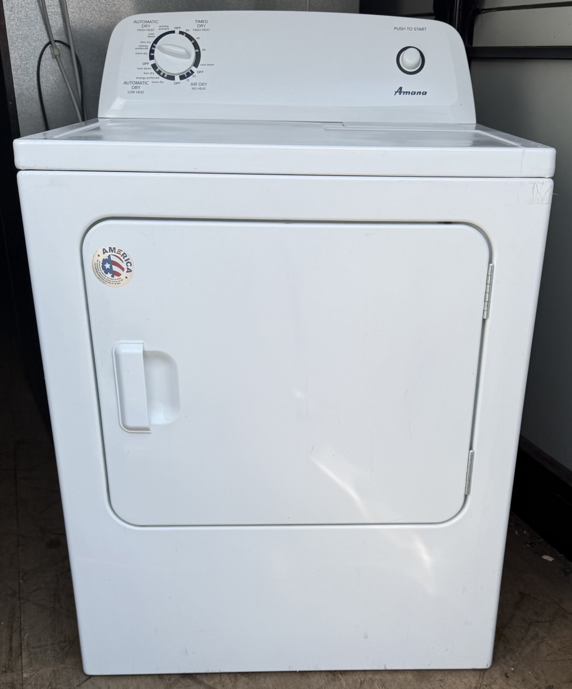 Amana 6.5 cu ft electric dryer in white, front view, door closed