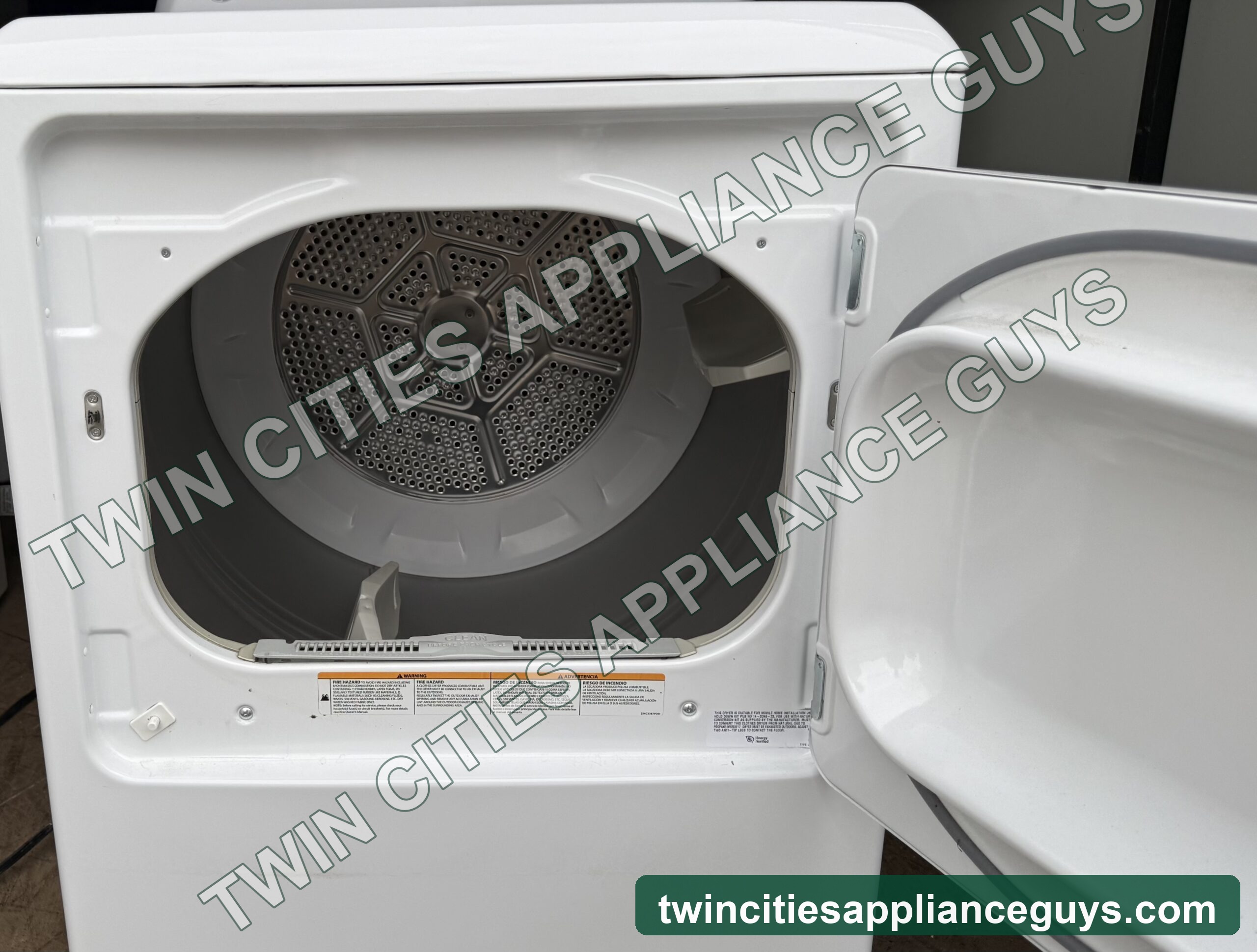 GE gas dryer open door showing the drum interior