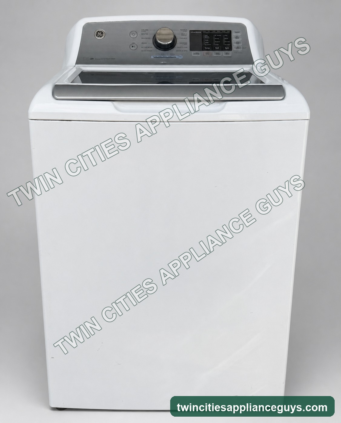 White GE smart top-load washer, closed front view