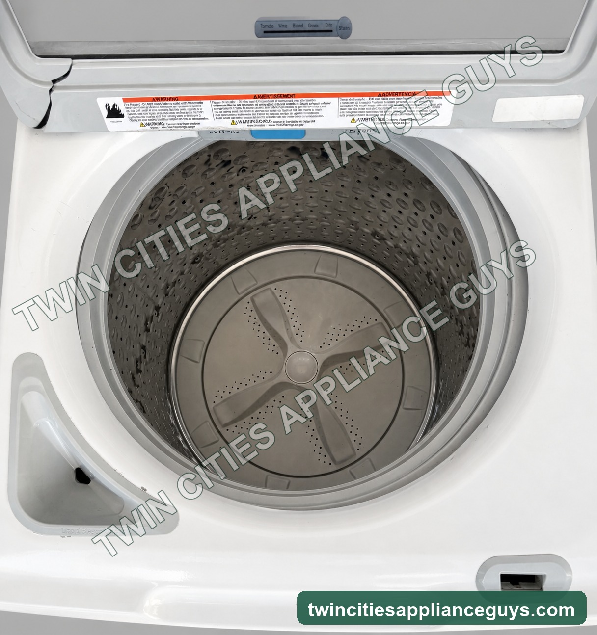GE washer interior with wash basket and lid open