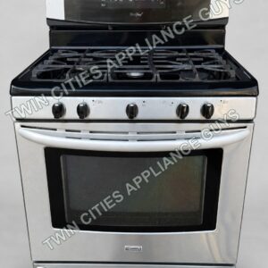 Kenmore stainless dual-fuel range on a clean light-gray studio background, front view