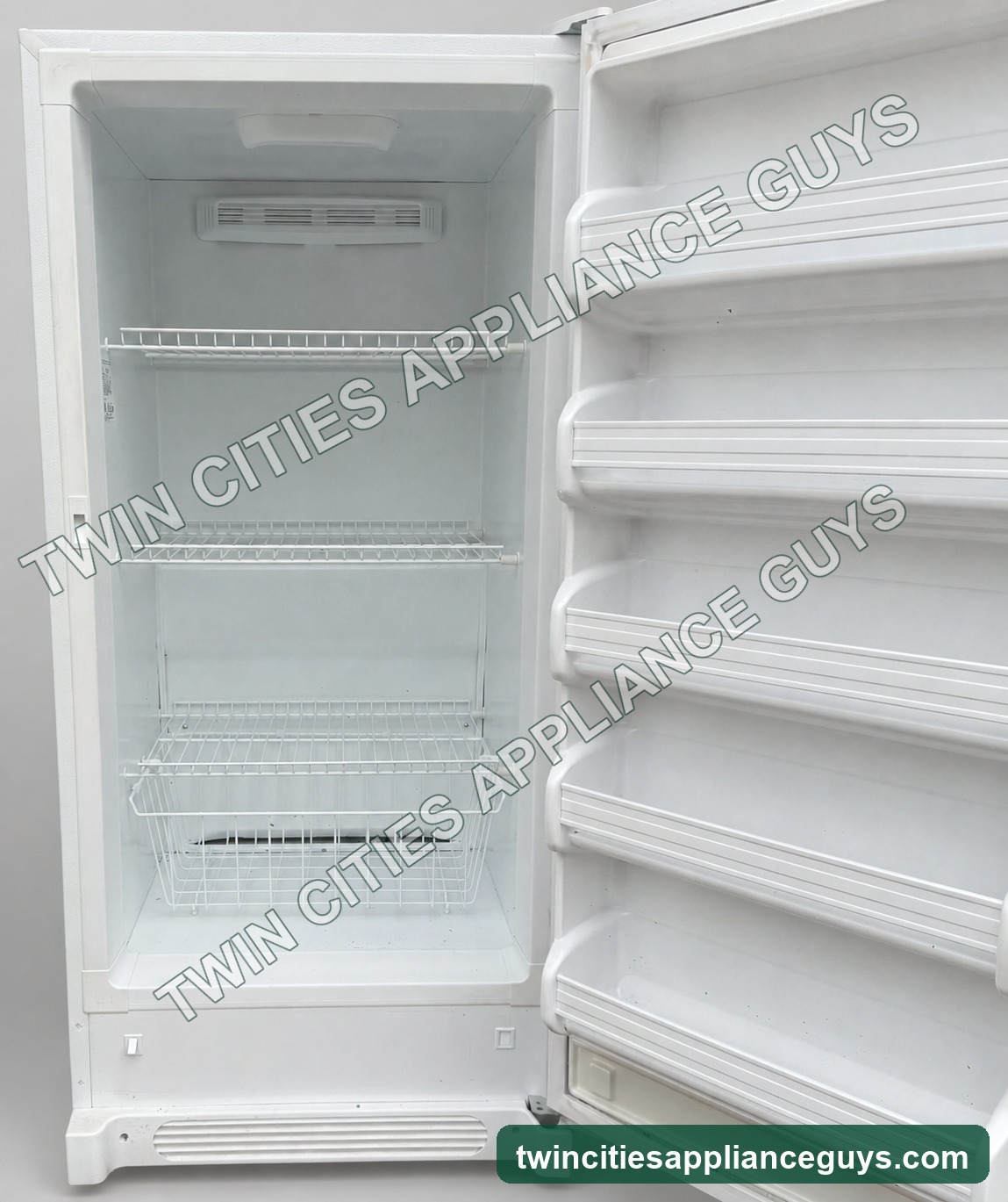 Frigidaire upright freezer open interior shelves and basket