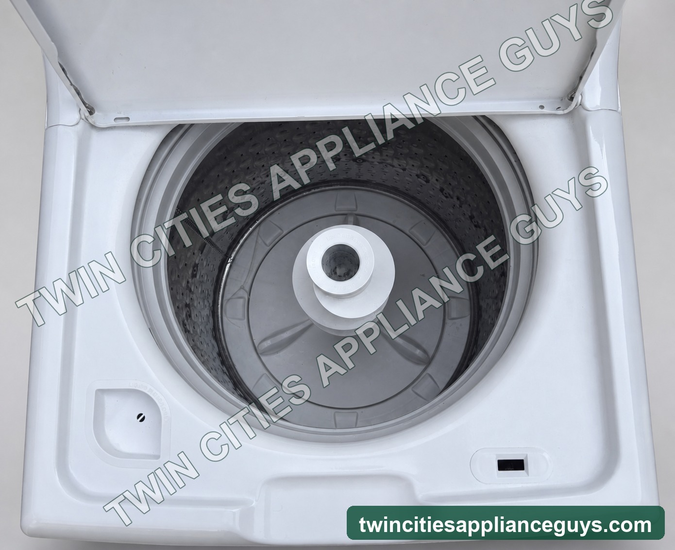 Open wash basket and agitator of GE top-load washer