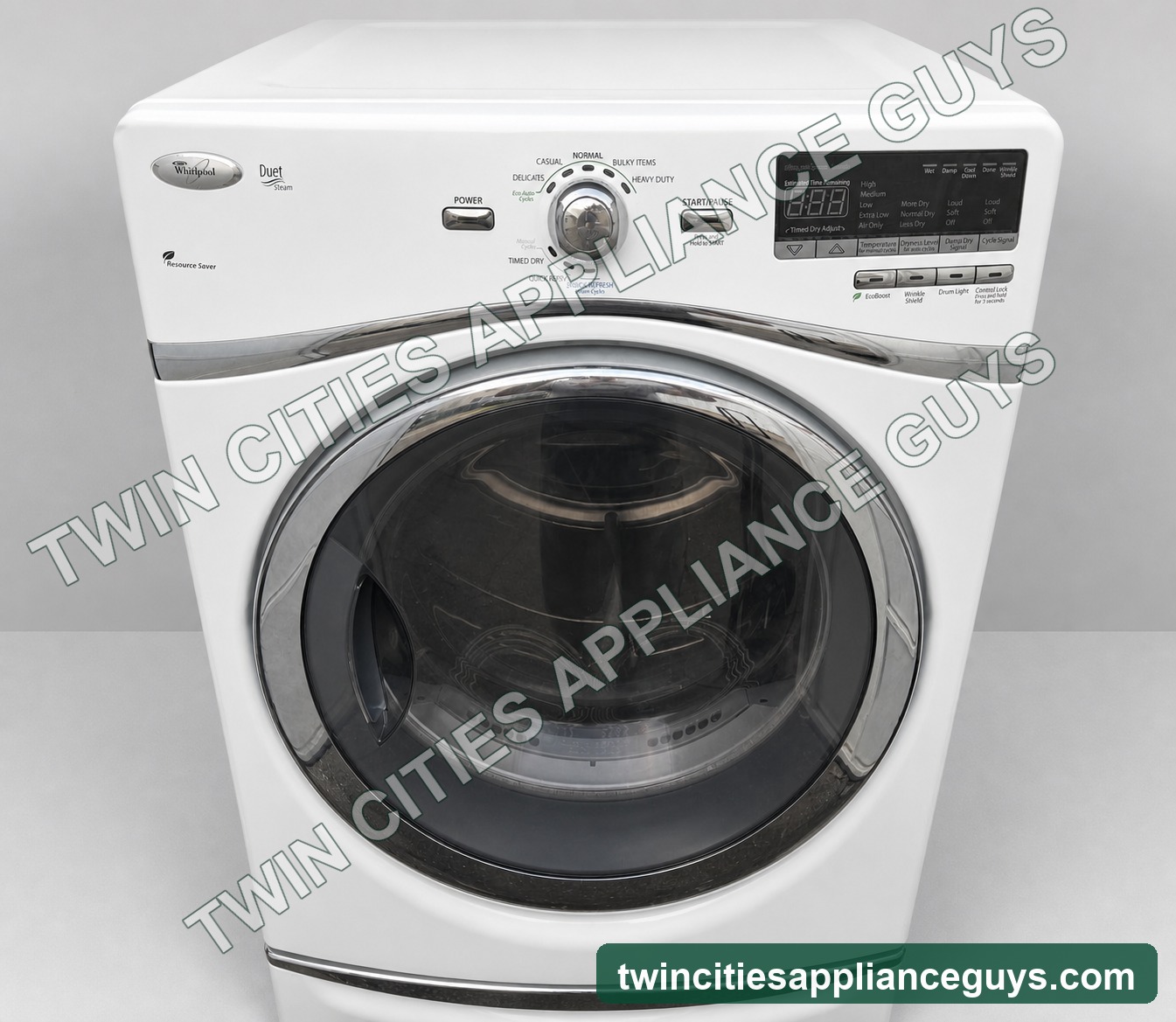 Whirlpool Duet Steam electric dryer controls and chrome door on a clean light-gray studio background