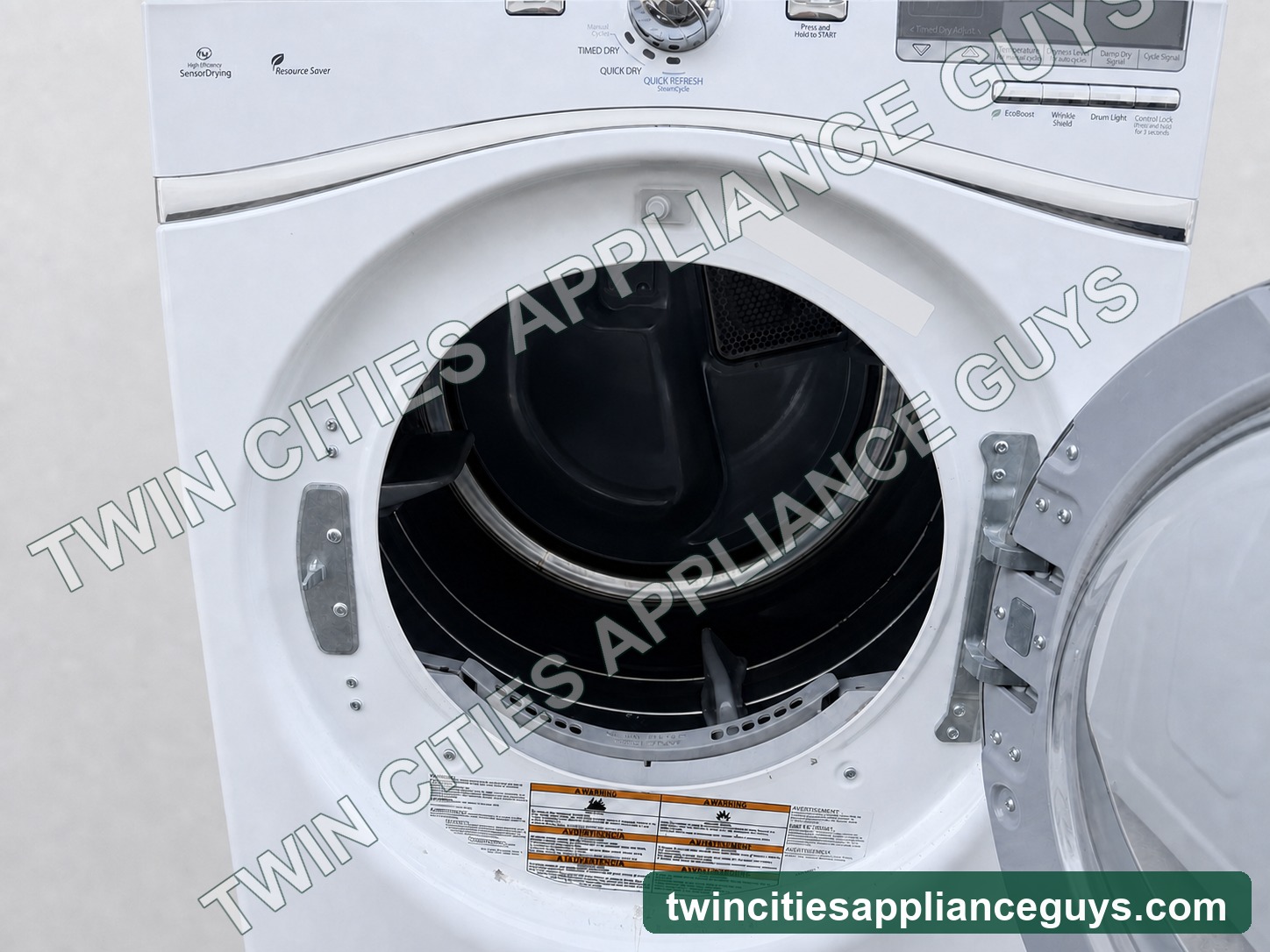 Whirlpool Duet electric dryer open drum interior on a clean light-gray studio background