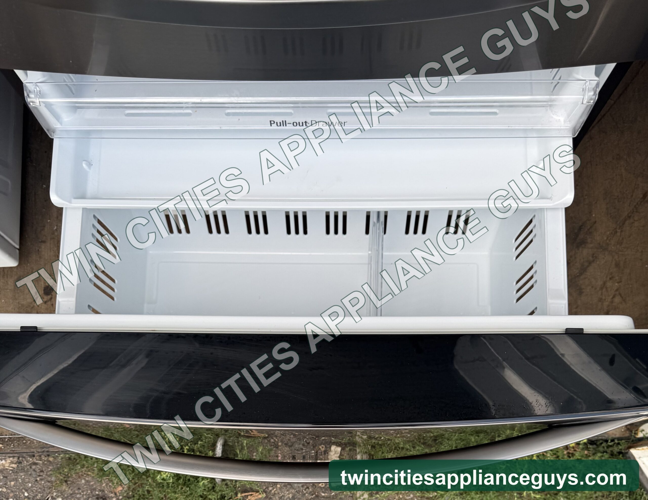 Refrigerator crisper drawer and shelf shown removed