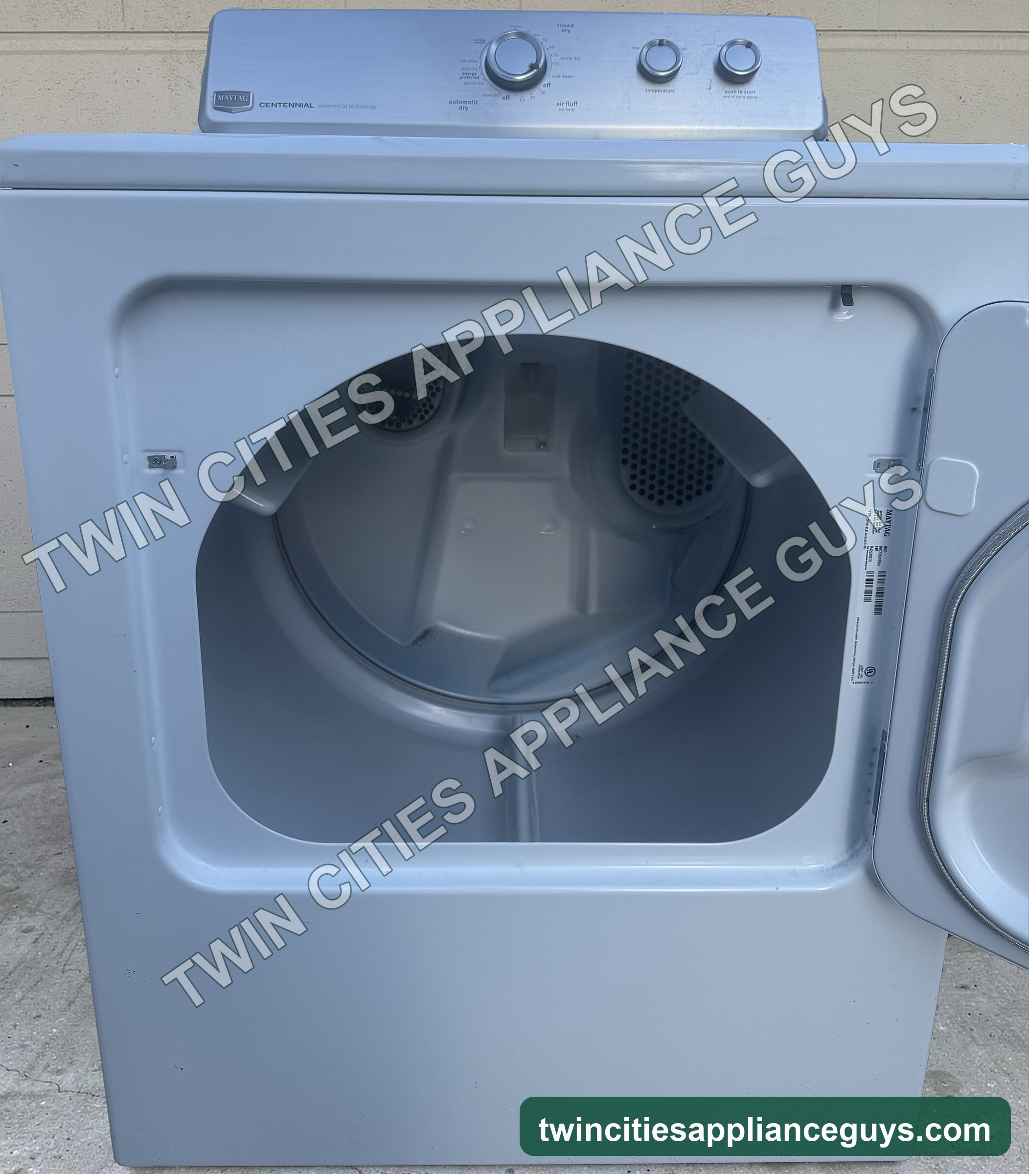 Maytag electric dryer with door open showing the drum