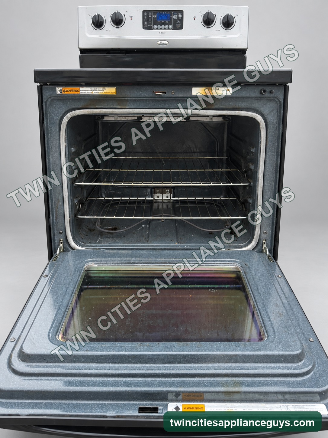 Whirlpool electric range with oven door open showing racks