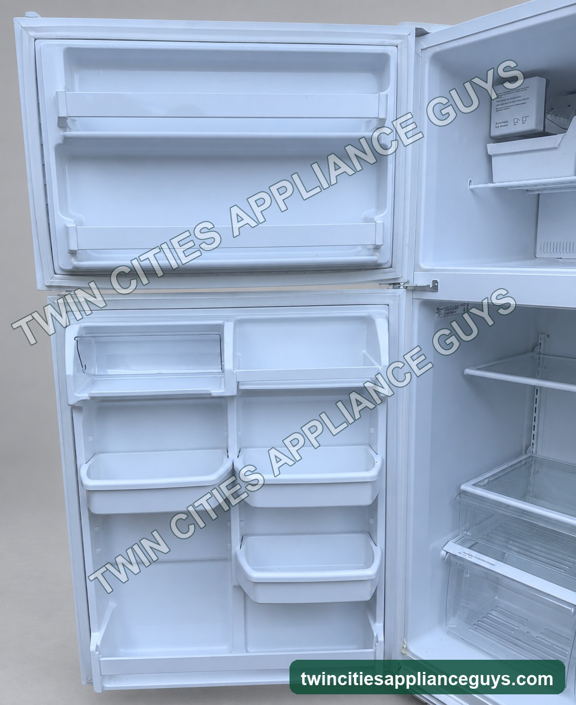 Additional interior view of white Whirlpool top-freezer refrigerator