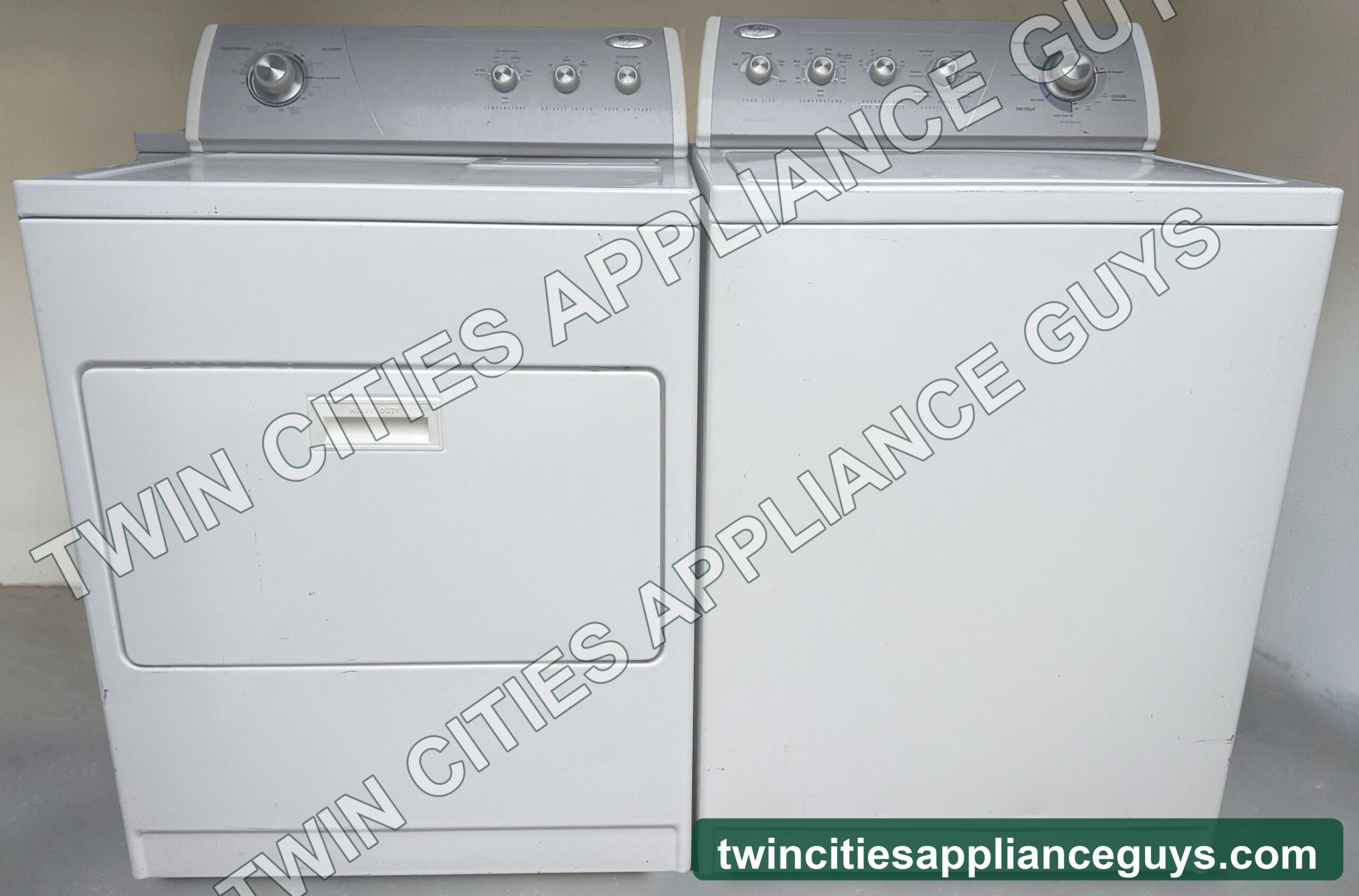 Whirlpool electric dryer and top-load washer side by side, front view