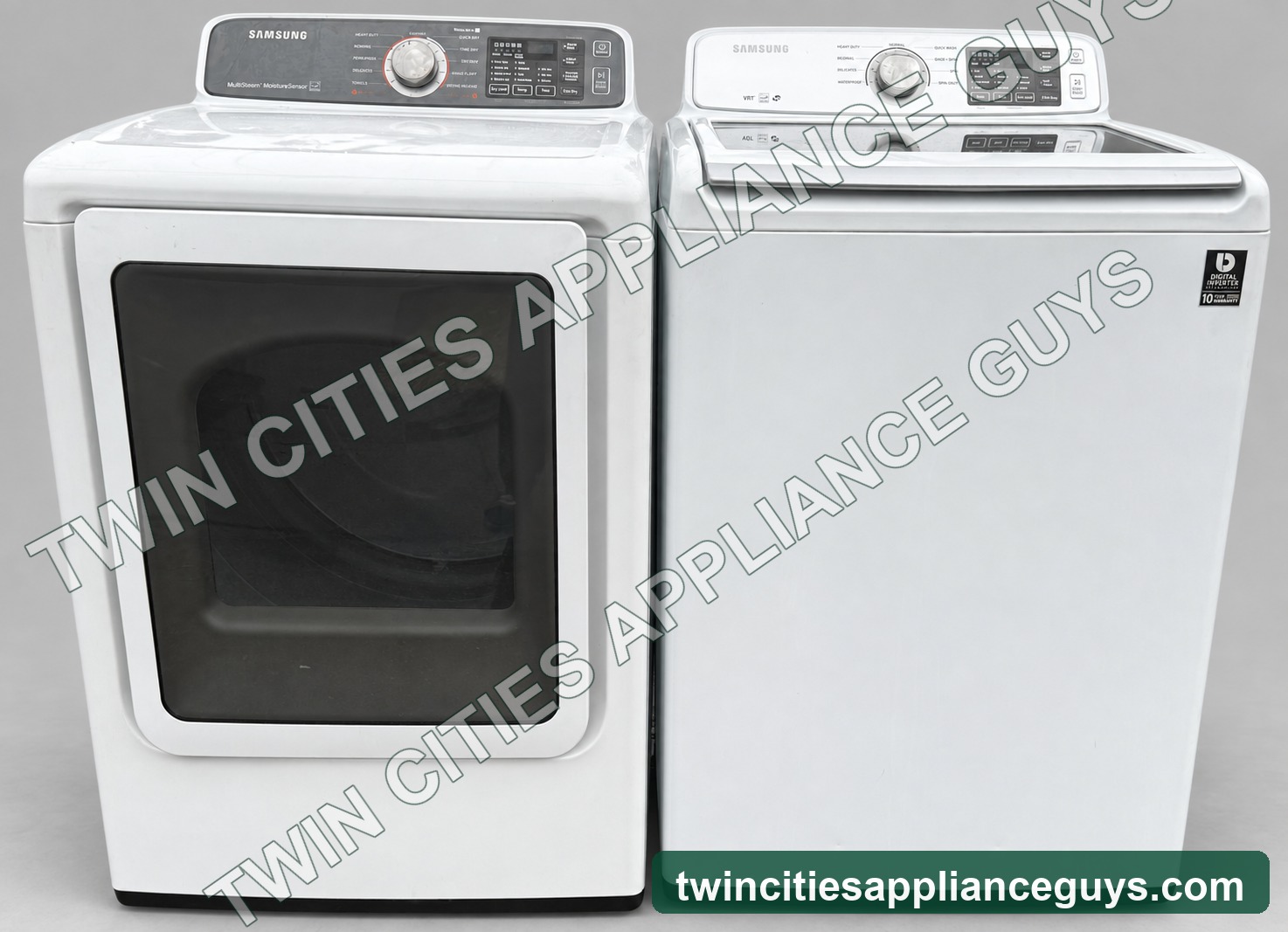 Front view of Samsung white top-load washer and gas dryer set