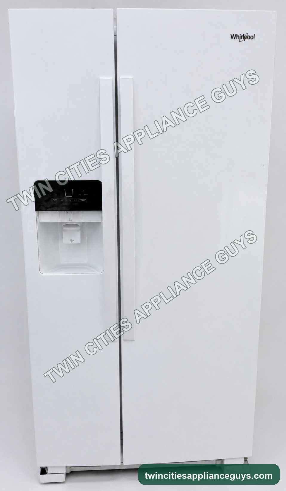 White Whirlpool side-by-side refrigerator closed front view with exterior dispenser