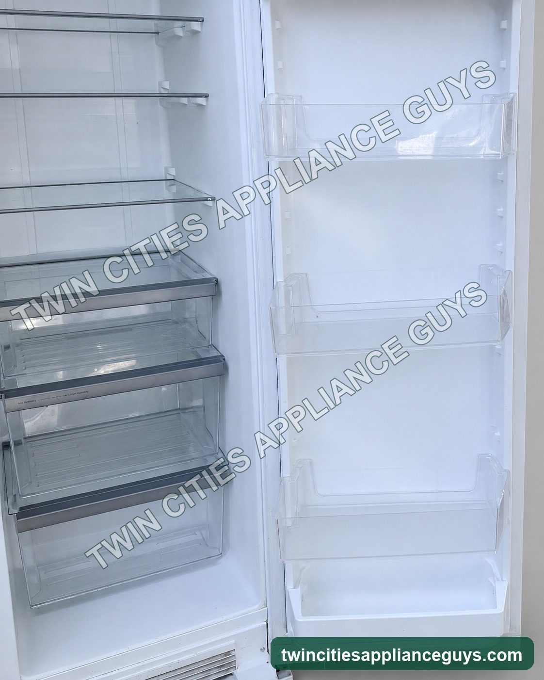 White Whirlpool refrigerator compartment and open right door interior