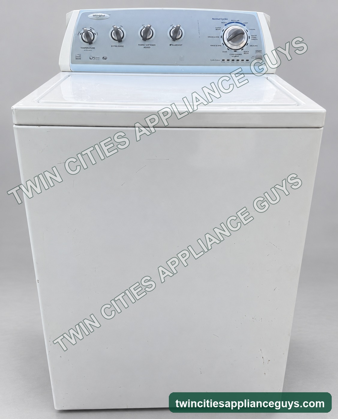 White Whirlpool high-efficiency top-load washer shown from the front