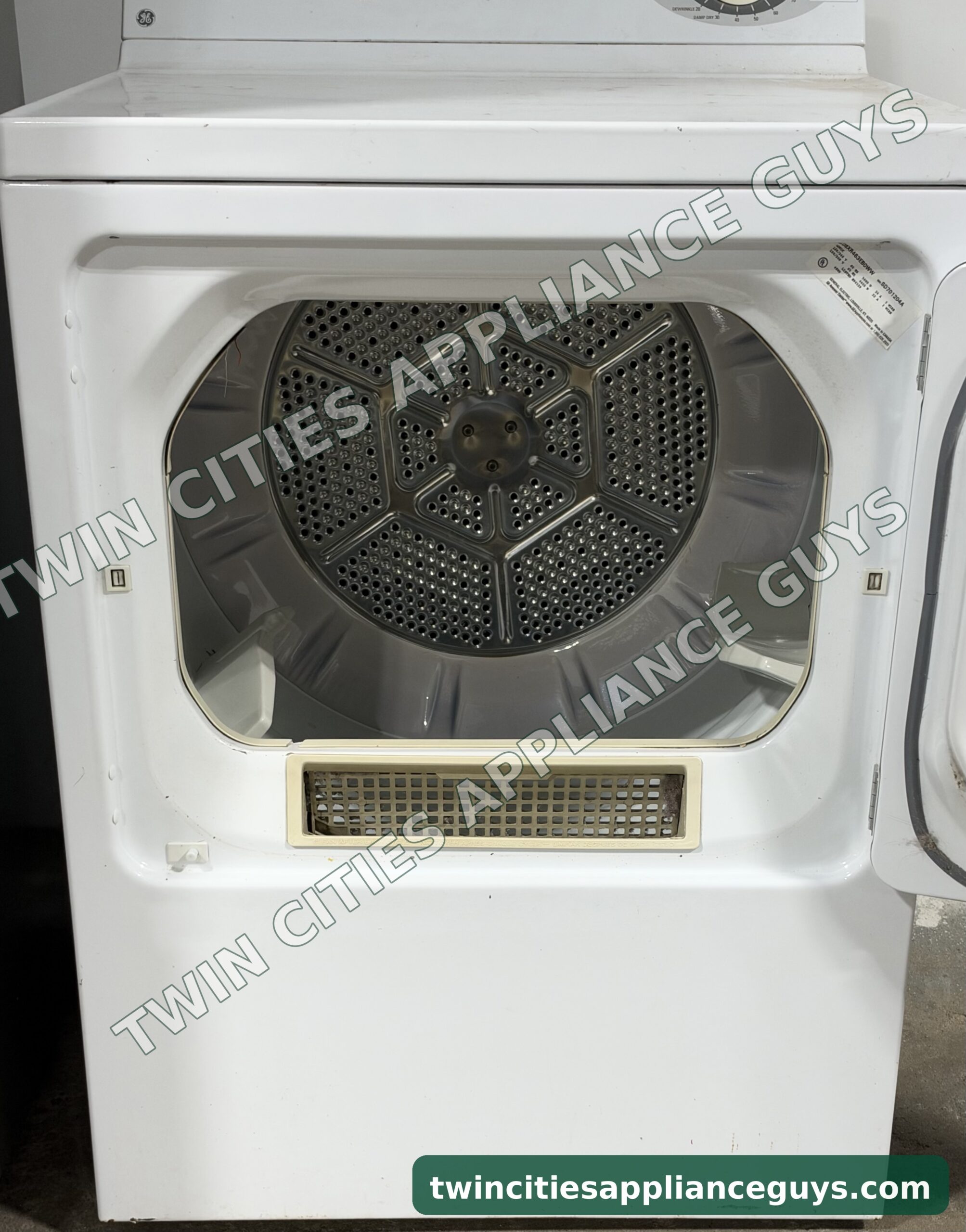GE electric dryer with the door open showing the drum and lint filter